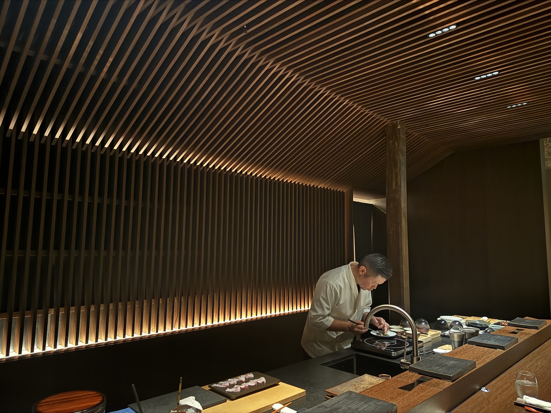 Chef preparing dishes at the Prefecture 48 counter